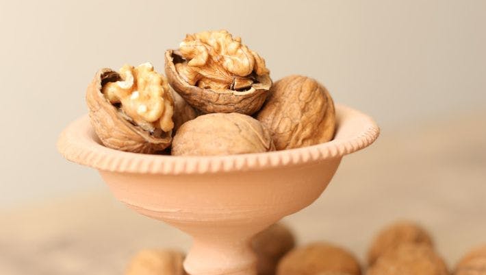 white ceramic bowl with brown and white mushrooms